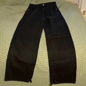 Shein.. black wide-leg jeans with slits on the bottom.